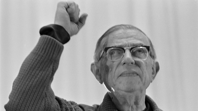 Jean-Paul Sartre raising a fist