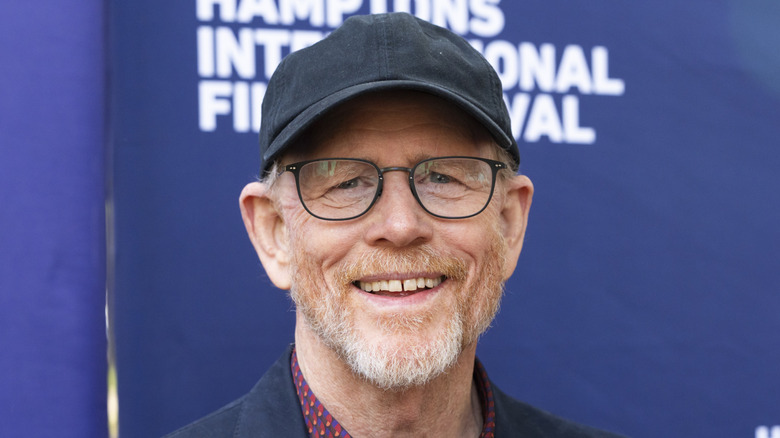 Ron Howard smiling in a baseball cap