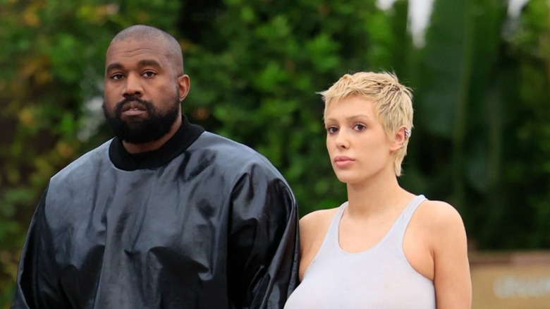 Bianca Censori and Kanye West holding hands