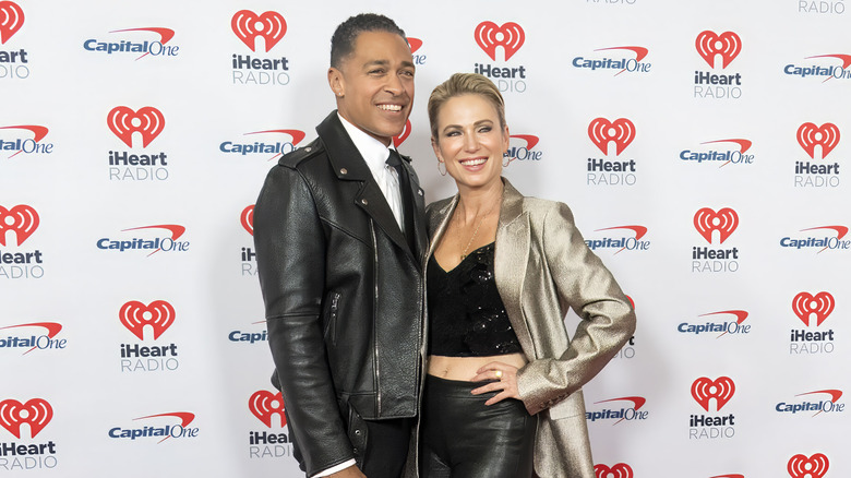 T.J. Holmes and Amy Robach posing on the red carpet