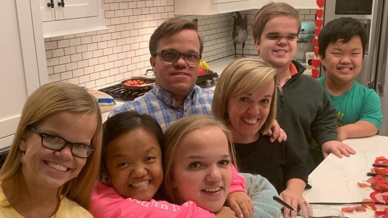 The stars of 7 Little Johnstons pose in their kitchen together
