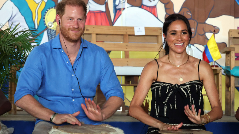 Harry and Meghan playing drums in Colombia