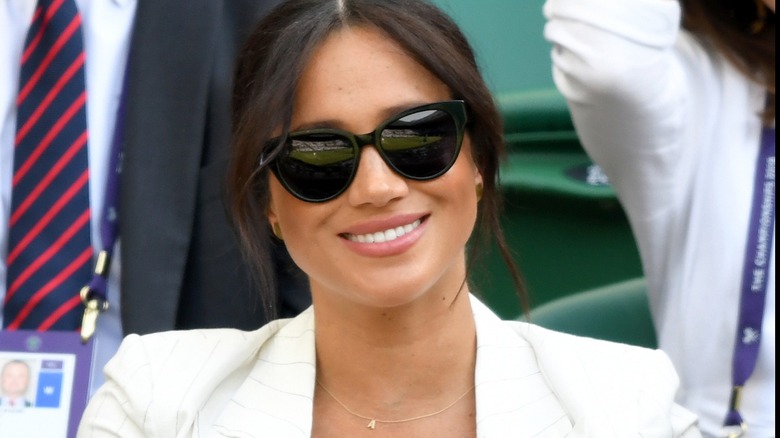 Meghan Markle at Wimbledon 2019 with sunglasses and A necklace