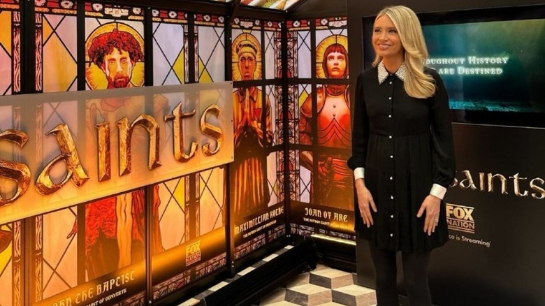 Kayleigh McEnany stands in a stained-glass set on Fox Square (2024)