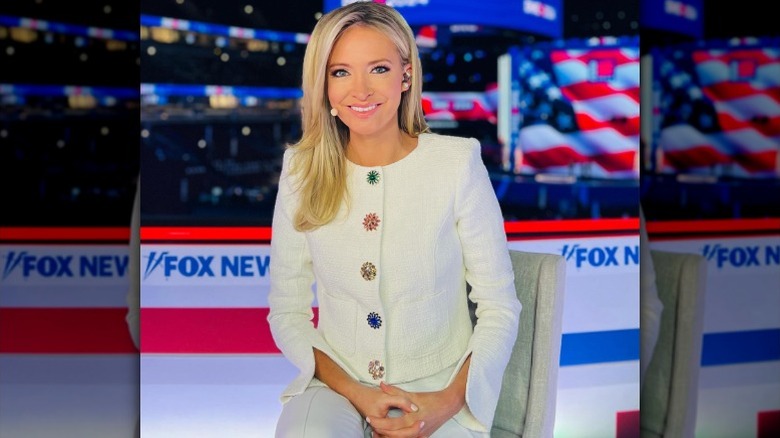 Kayleigh McEnany behind the desk at Fox News studios in a white cardigan (2024)