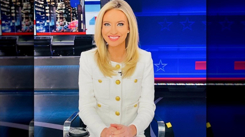 Kayleigh McEnany at the Fox News studio in a glaring white blazer with gold buttons (2024)
