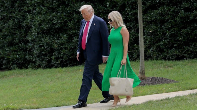 Donald Trump and Karoline Leavitt walk to the South Lawn of the White House in Washington, DC (2025)