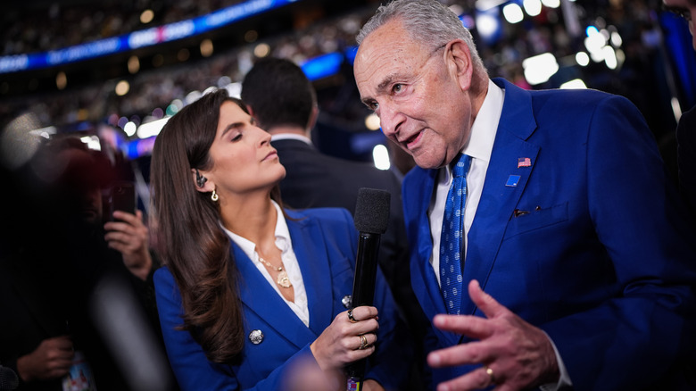 Chuck Schumer speaks with journalist Kaitlan Collins during the second day of the Democratic National Convention at the United Center on August 20, 2024 in Chicago, Illinois.