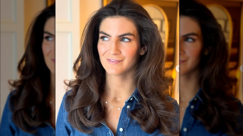 Kaitlan Collins showing off her hair, which was styled by Kendra Lauren who shared this photo to Instagram in October 2025.