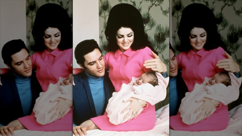 Elvis and Priscilla holding their infant daughter, Lisa Marie.