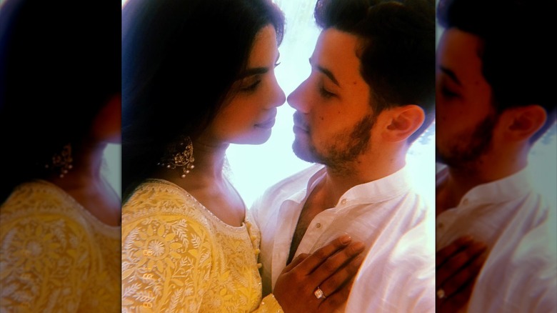 Nick and Priyanka posing in traditional Indian wedding attire