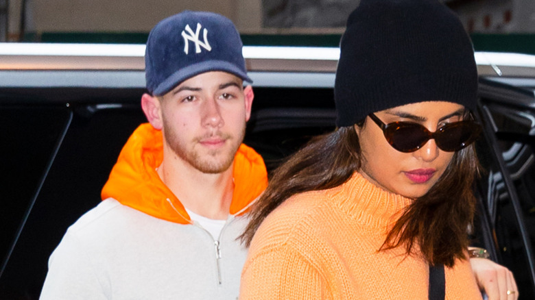 Nick Jonas walking behind Priyanka Chopra in NYC
