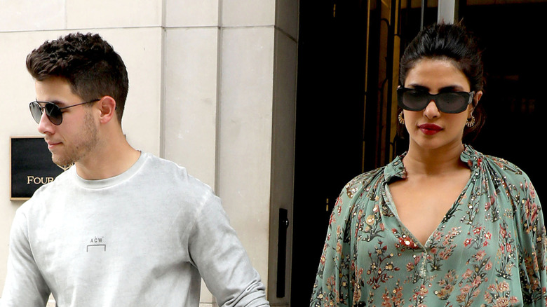 Priyanka and Nick Jonas walking down a NYC street