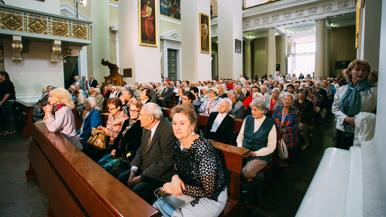 people seated at a church funeral
