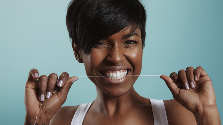 woman flossing