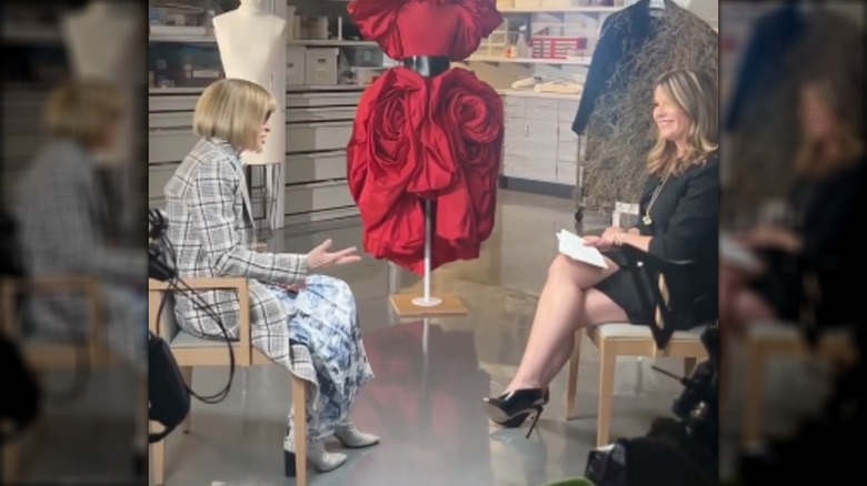 Jenna Bush Hager smiling and talking to Anna Wintour