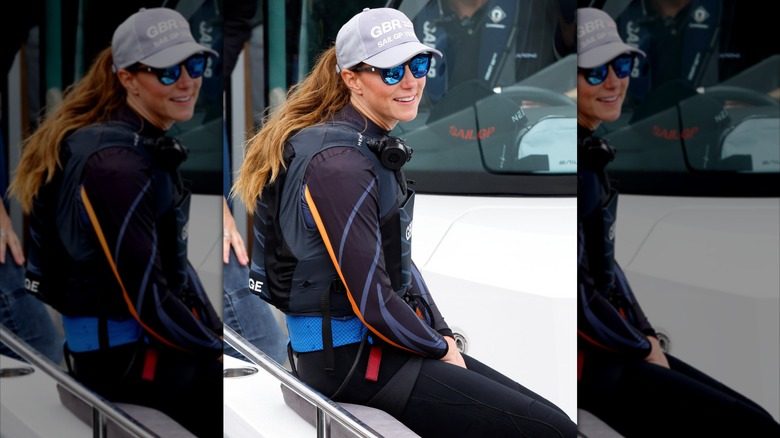 Kate Middleton wore a gray baseball cap and sunglasses.