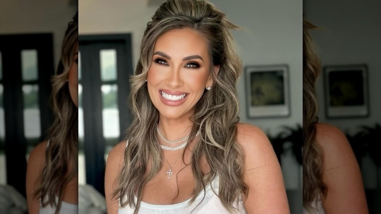 Katrina Campins smiles for the camera in her home (2025)