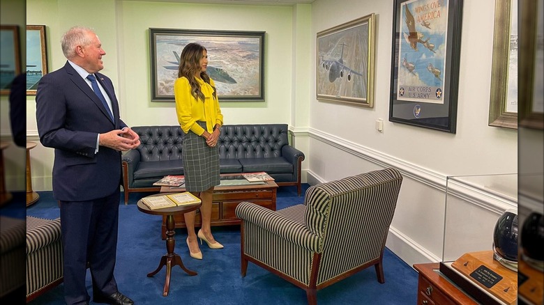 Kristi Noem looking at a painting