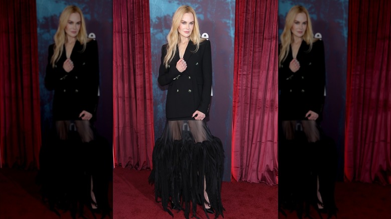 Nicole Kidman poses in a black blazer over a sheer skirt
