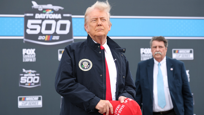 Donald Trump holding baseball cap Daytona 500