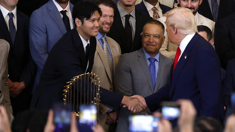 Donald Trump shaking Shohei Otani's hand World Series trophy