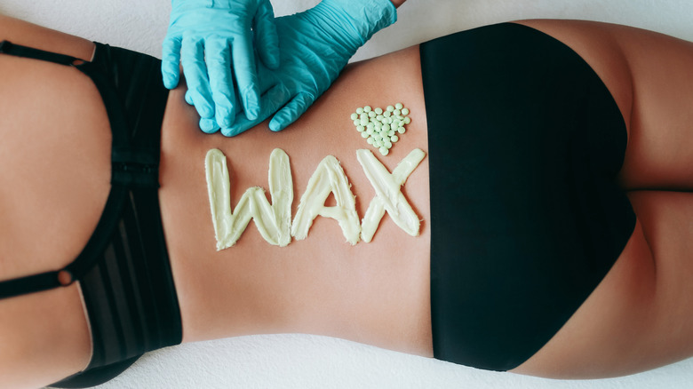 Woman with wax on back