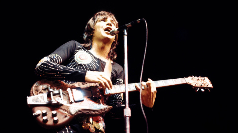 David Cassidy playing guitar and singing