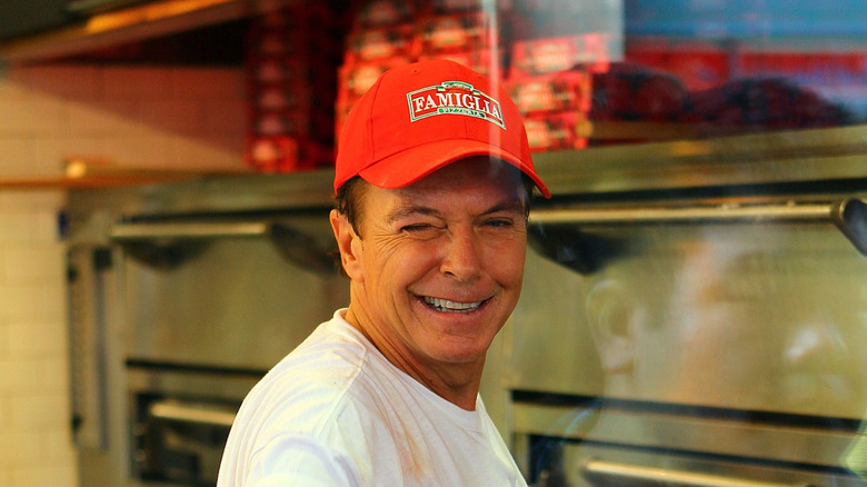 David Cassidy in a red cap winking at the camera