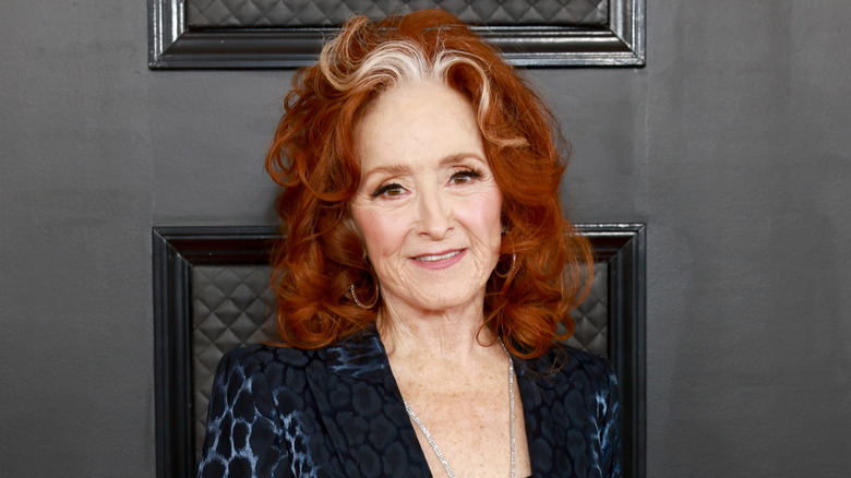 Bonnie Raitt posing at music industry event