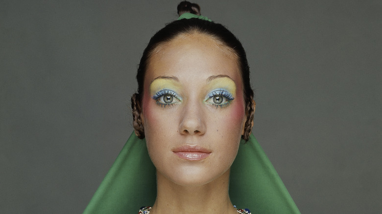 Marisa Berenson posing and wearing colorful 1970s makeup