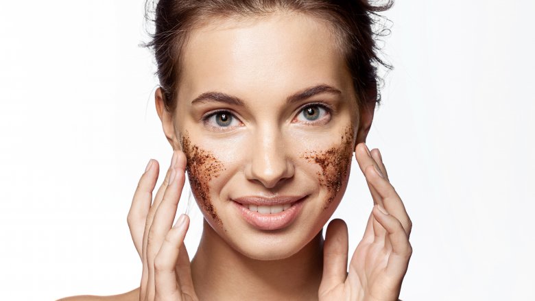 woman applying homemade facial scrub