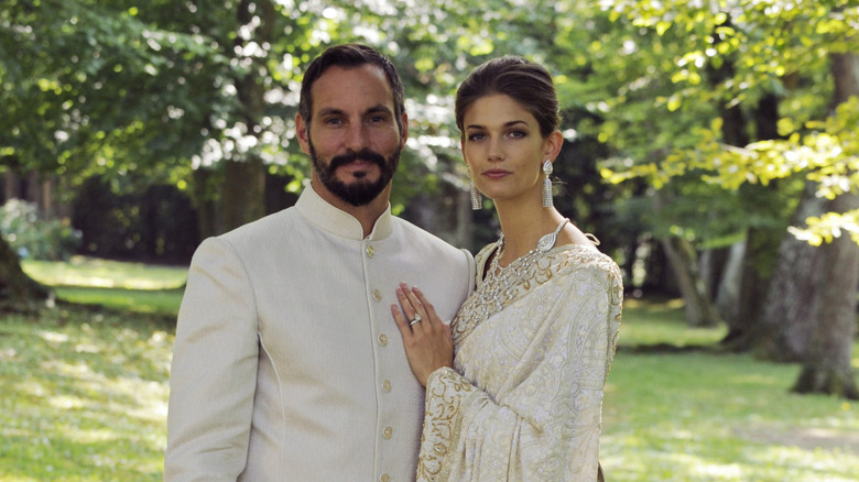 Kendra Spears in a white sari beside her husband Prince Rahim Aga Khan V