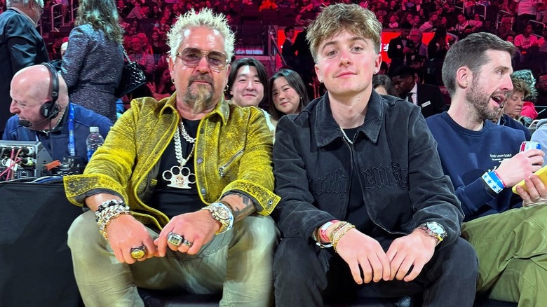 Guy and Ryder Fieri sitting at basketball game