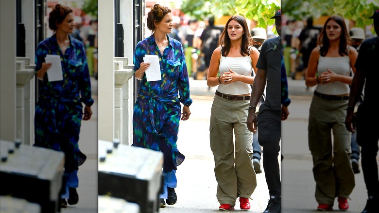 Katie Holmes in blue and purple robe with Suri Noelle in khaki pants in Manhattan 2025