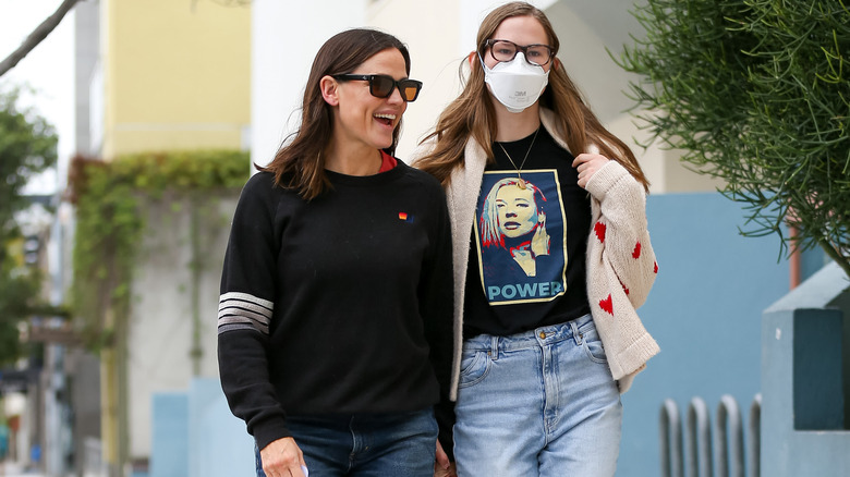 Jennifer Garner and Violet Affleck wearing mask and POWER t-shirt