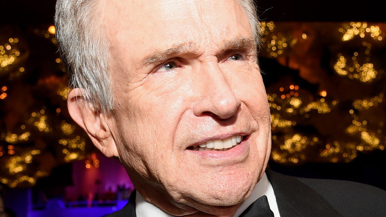 Warren Beatty looking up