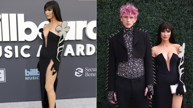 Megan Fox in a black dress with silver flowers on the sleeves at an event with Machine Gun Kelly