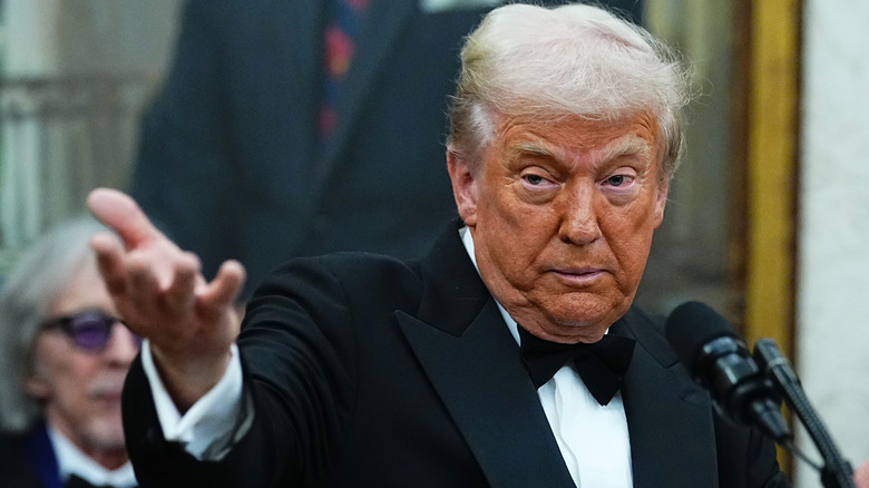 Donald Trump indicating someone out of the shot