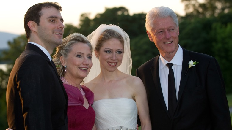 Marc Mezvinsky, Hillary Clinton, Chelsea Clinton, and Bill Clinton posing for a photo in 2010