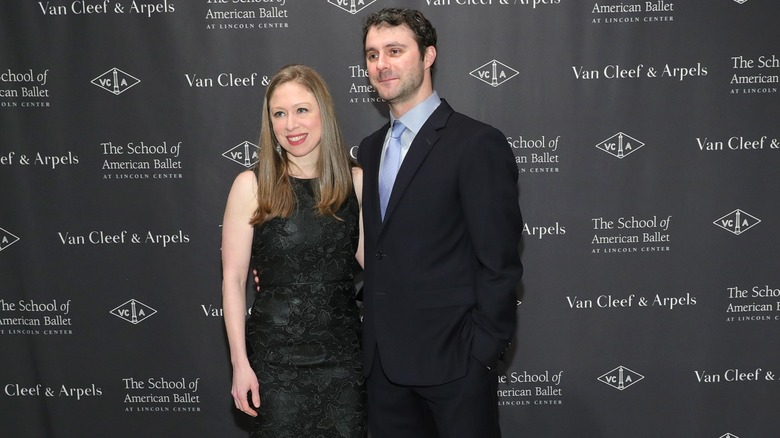 Chelsea Clinton and Marc Mezvinsky posing at an event in 2017