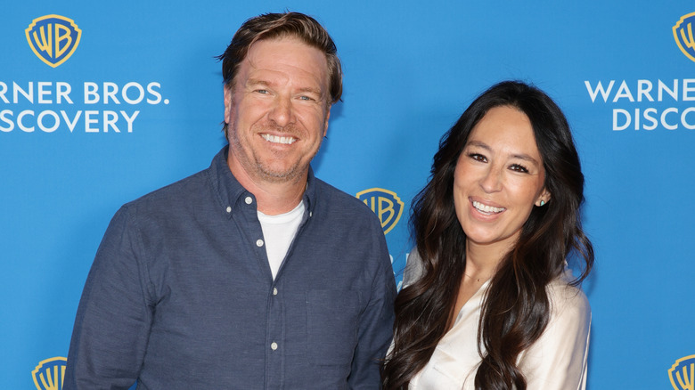 Chip and Joanna Gaines smiling at the Warner Bros. Discovery Upfront event in 2022
