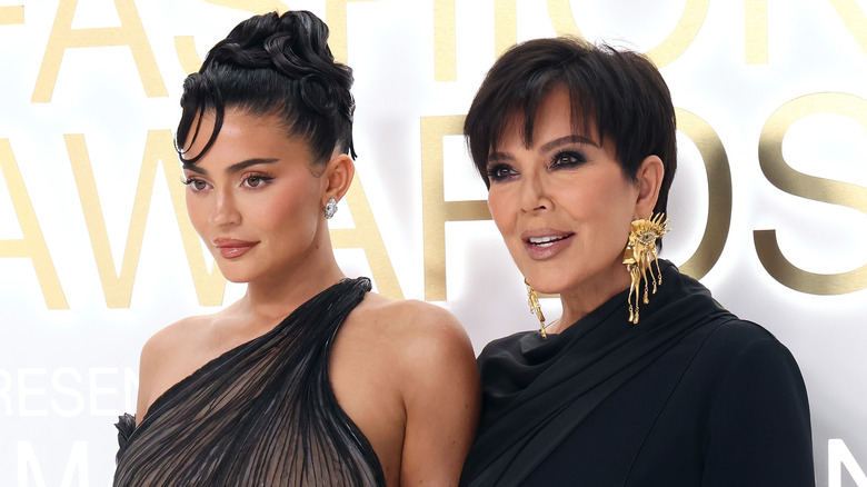 Kylie Jenner and Kris Jenner posing on a red carpet