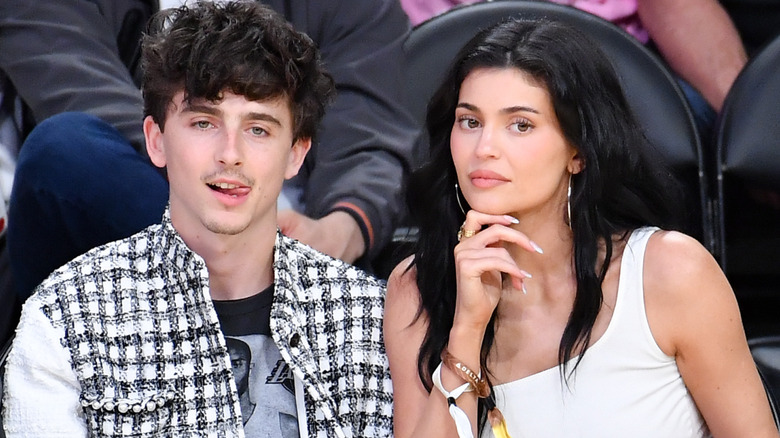 Kylie Jenner and Timothée Chalamet sitting courtside
