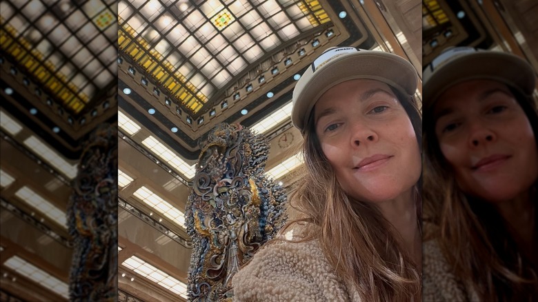 Drew Barrymore closeup no makeup baseball cap