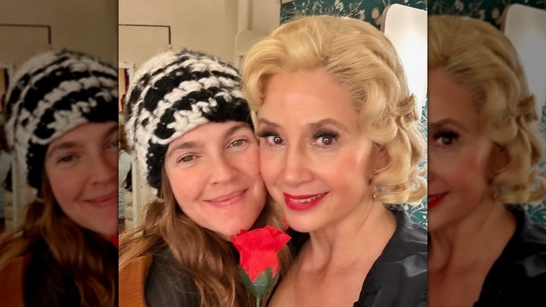 Drew Barrymore closeup smiling and posing wearing a knit cap no makeup with Mira Sorvino