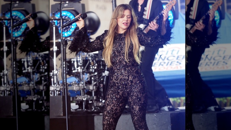 Kelly Clarkson purple lace bodysuit performing