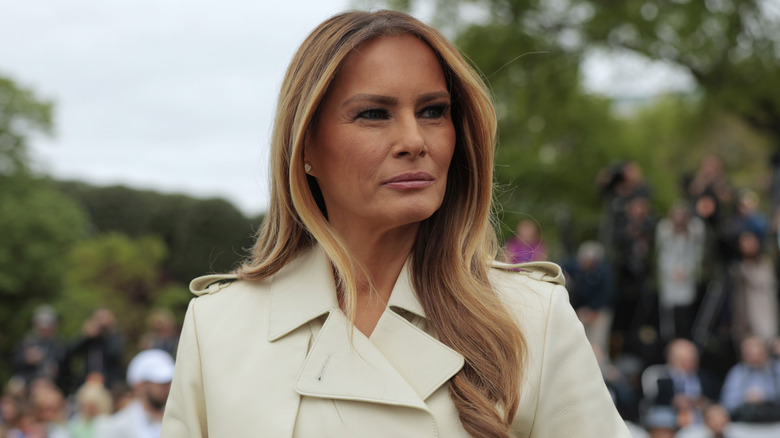 First lady Melania Trump looks on as U.S. President Donald Trump greets guests durning the White House Egg Roll on the South Lawn of the White House on April 21, 2025 in Washington, DC (2025)