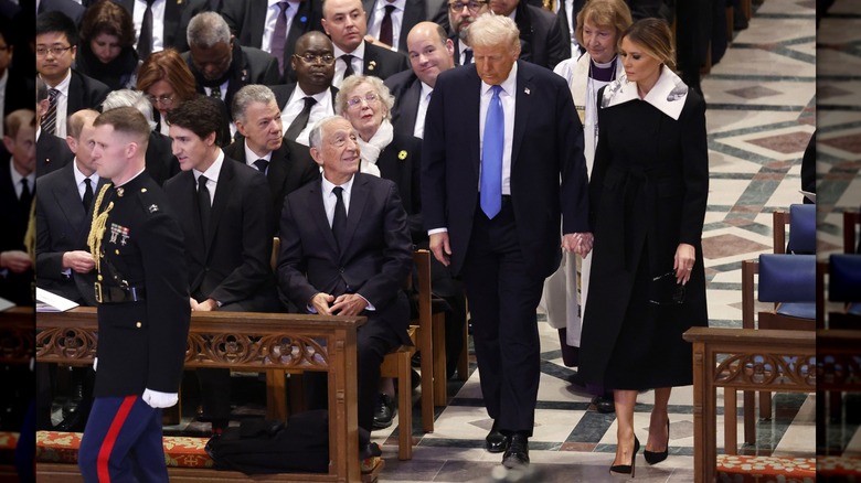 U.S. President-elect Donald Trump and incoming first lady Melania Trump arrive for the state funeral for former U.S. President Jimmy Carter at Washington National Cathedral on January 9, 2025 in Washington, DC (2025)