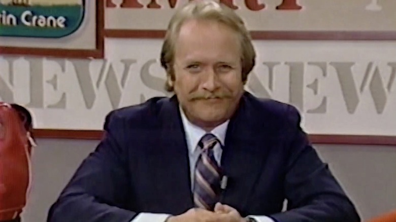 Martin Mull as a television presenter in "Domestic Life"